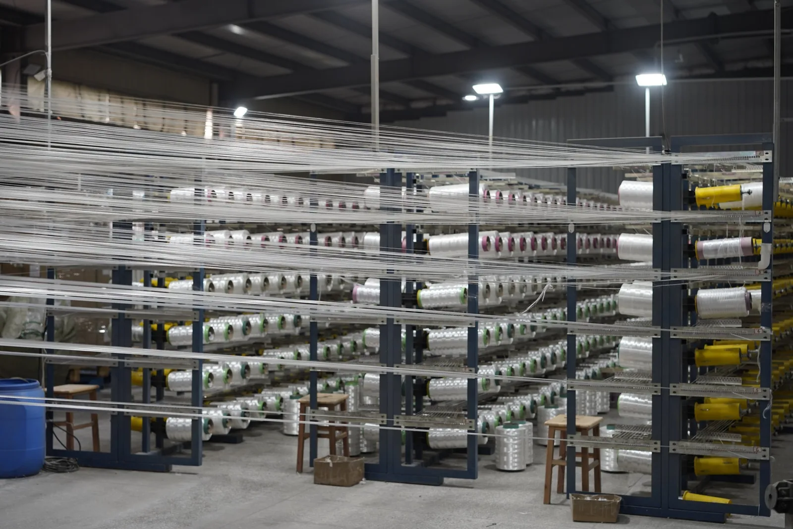 UHMWPE yarn packages loaded on a creel frame